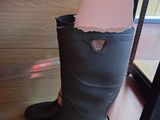 a boot that has a piece of paper sticking out of it