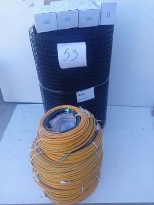 a stack of wires and a coil of wires on the ground