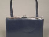 navy blue leather handbag with metal handle