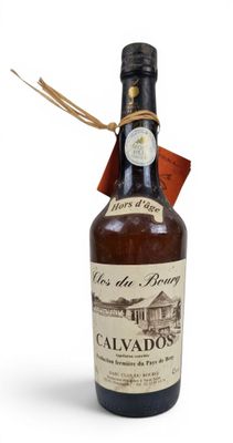 an old bottle of calvados with a tag on it