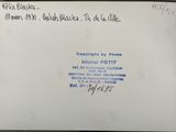 an envelope with a handwritten message on it sitting on a table