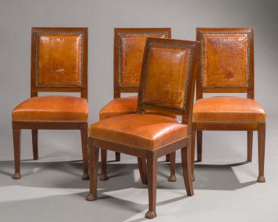 four chairs with leather upholstered backs and wooden legs