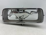 silver plated belt buckle with a running horse on it