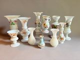 many vases that are sitting on a table