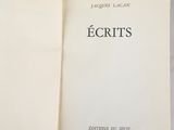 an open book with the title ecrits written in black on it