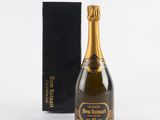 a bottle of champagne in front of a black box