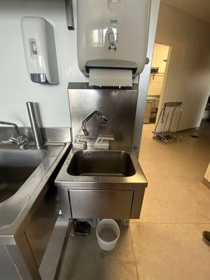 a stainless steel sink and a stainless steel sink in a kitchen