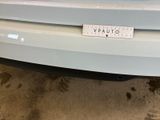 a close up of a car with a sticker on it ' s bumper