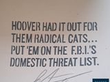 a sign that says hoover had it out for them radical cats put them on the r r i s domestic threat list