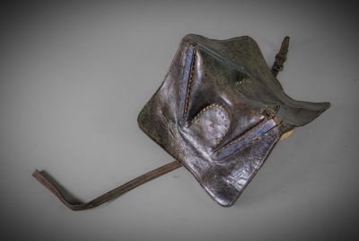 a small metal object that is hanging on a hook