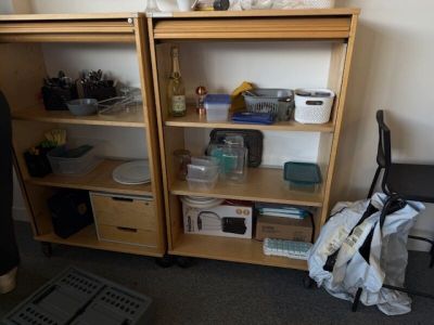 a shelf with many items on it in a room