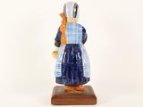 a figurine of a woman in a blue dress
