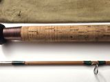 a fishing rod and a fishing pole on a table