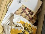a suitcase full of books and papers on the floor