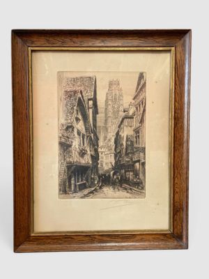 an old picture of a city street in a wooden frame
