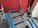 a blue cart that is sitting on the floor