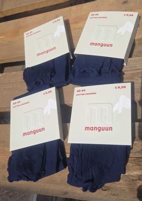 four pairs of men ' s socks sitting on top of a wooden bench