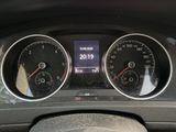 a close up of a car dashboard with gauges and speedometers