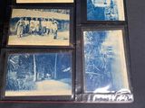 several old photos of a group of people on a table