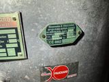 a close up of a metal box with some stickers on it