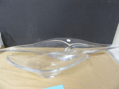 a glass bowl on a table with a note attached to it