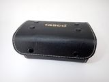 a black leather case with a taco logo on it
