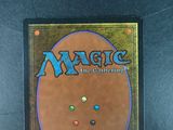 the back cover of a card game with a picture of a smiling face on it
