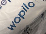 a bag of sleep bags sitting on top of a table