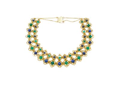 a close up of a necklace on a white background