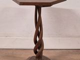 an image of a small wooden table with a spiral design