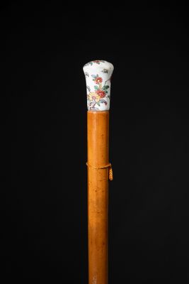 a close up of a wooden stick with a floral design on it