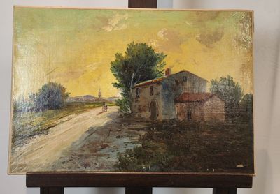 une peinture à l'huile représentant une maison, posée sur un chevalet devant un mur blanc