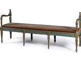 a bench that is made of wood and has a brown leather seat