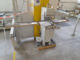 a picture of a machine that is cutting a piece of wood