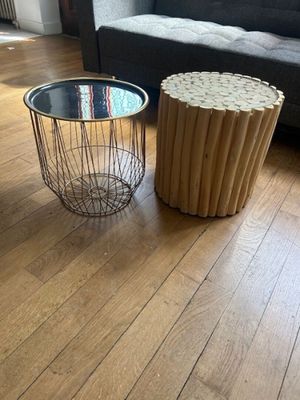 two tables that are on the floor in the living room