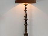 a lamp that is on a table with a lamp shade on it