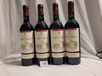 three bottles of red wine are lined up on a table