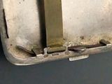 a metal container with a knife sticking out of it