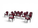 a set of eight chairs with red leather upholstered seats