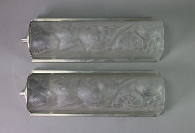 two empty glass bottles sitting on a table