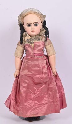 an image of a doll is wearing a pink dress and black shoes