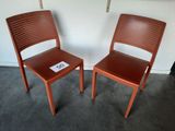 two chairs sitting next to each other on the floor