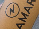 a person holding a box with a logo on it