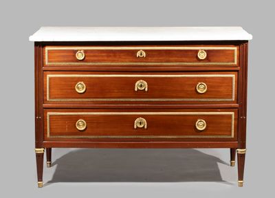 an antique chest of drawers with marble top and brass handles