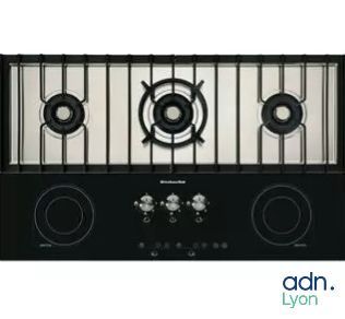 an image of a black stove top with four burners