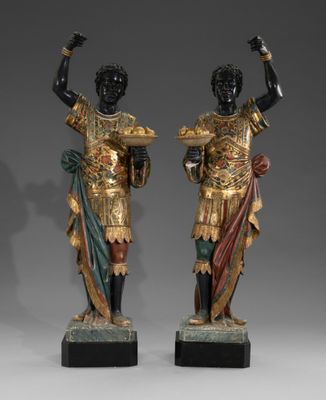 pair of bronze statues of a roman soldier and a roman woman