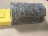 a silver box with a yellow box in it
