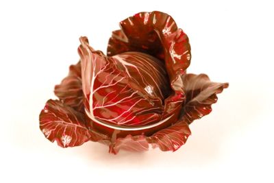 a close up of a red cabbage on a white background
