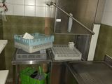 a kitchen with a sink and a refrigerator in it