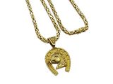 a close up of a gold necklace with a roman helmet on it